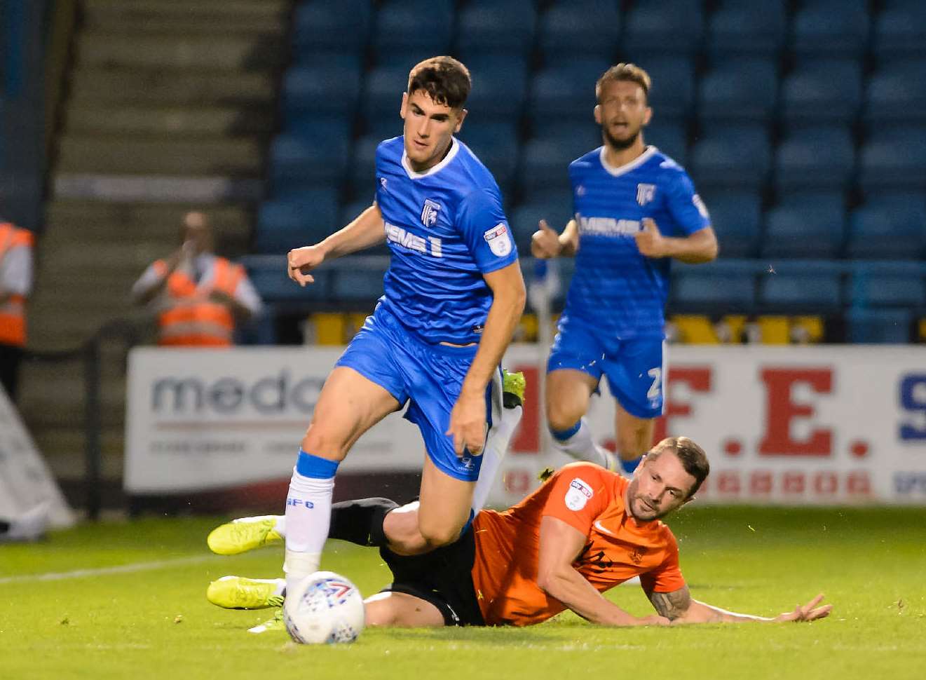 Conor Wilkinson drives forward for Gillingham Picture: Andy Payton