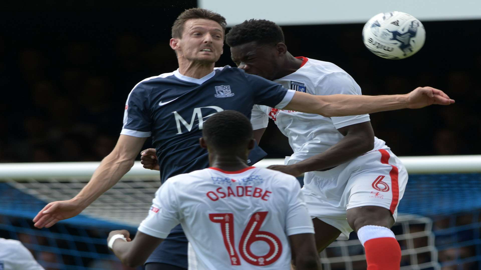 Deji Oshilaja heads clear for Gills. Picture: Barry Goodwin