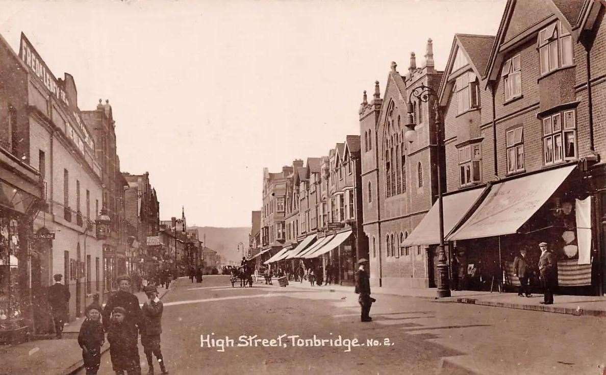 Tonbridge High Street around 1900 with the church prominent on the street scene