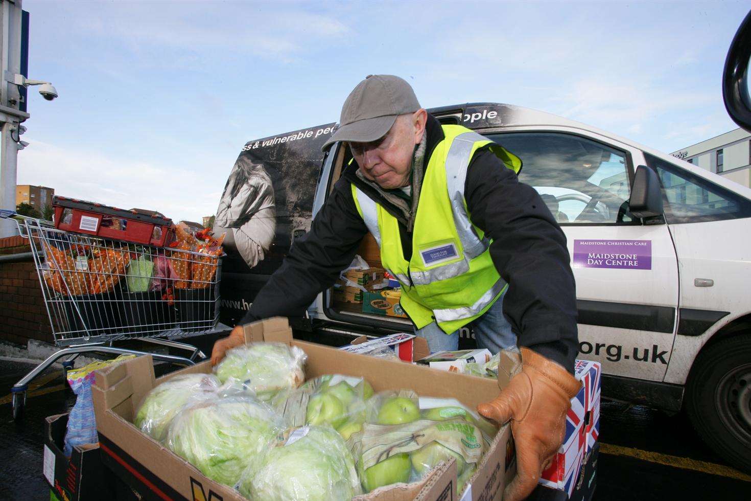 Peter Downs loads a pallet of stock from a supermarket to help the "hidden homeless" who need an emergency food par
