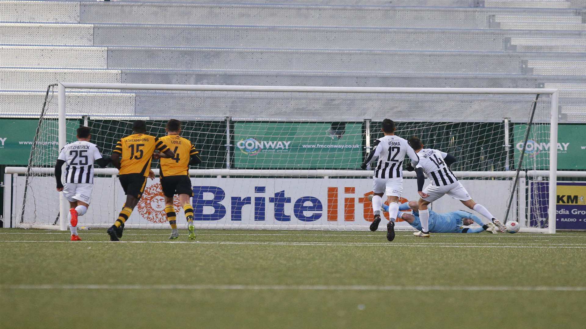 Lee Worgan saves Brett Williams' penalty in front of the new North Stand Picture: Andy Jones
