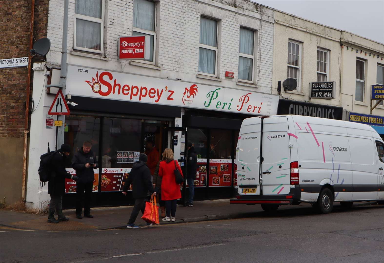 TV trucks outside Sheppey'z Piri Piri in Sheerness High Street where Victoria Derbyshire's live BBC Two show was broadcast live