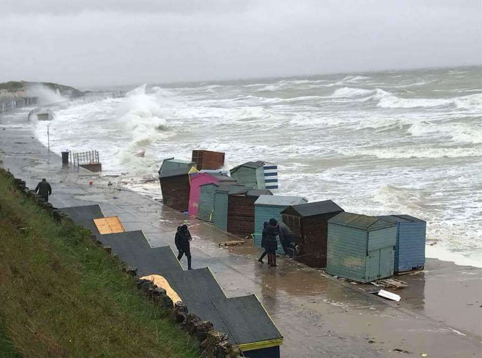 Beach huts washing into the sea. Picture: Ryan Hosking