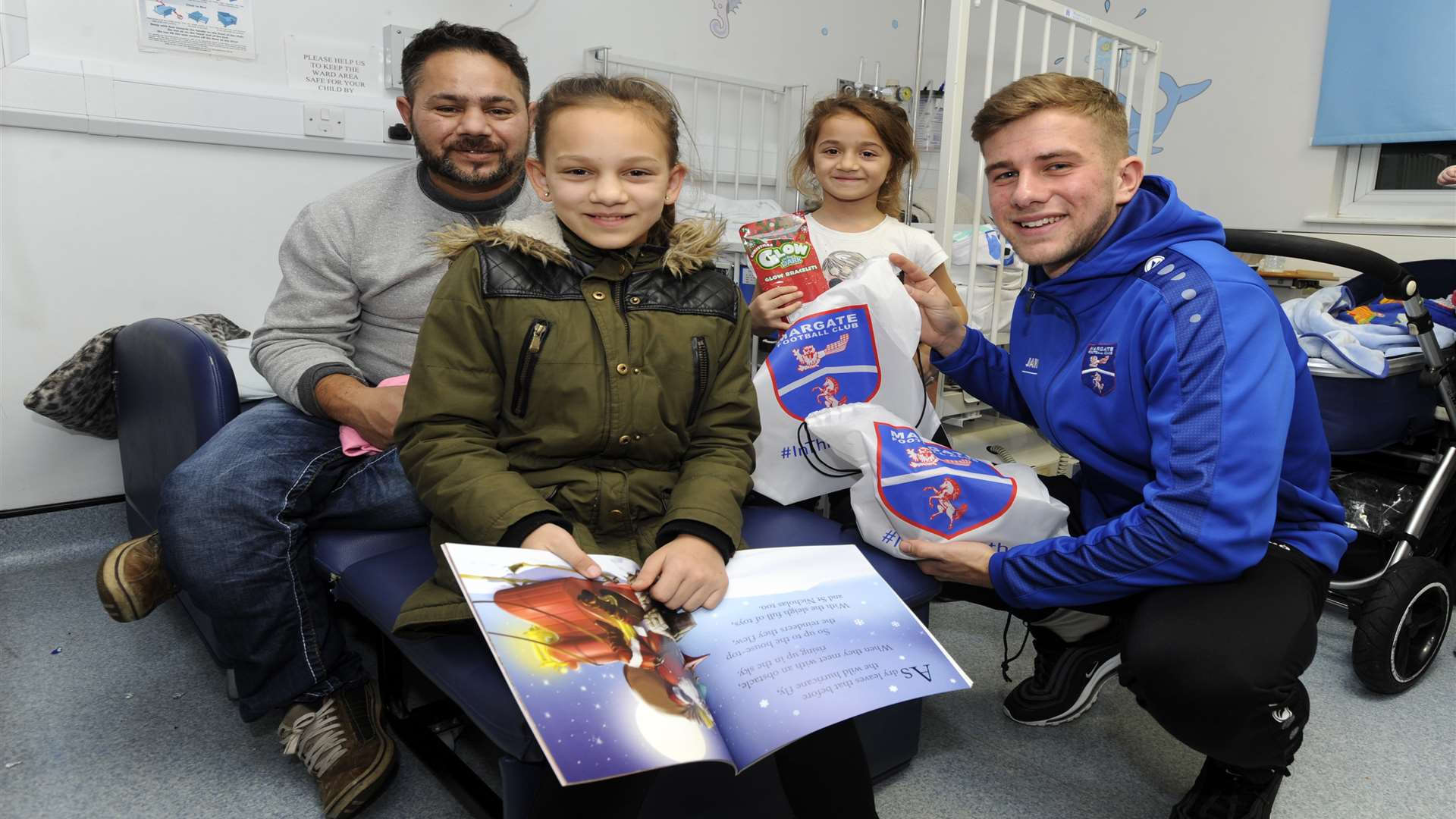 Margate defender Ben Swift with a family on Rainbow Ward