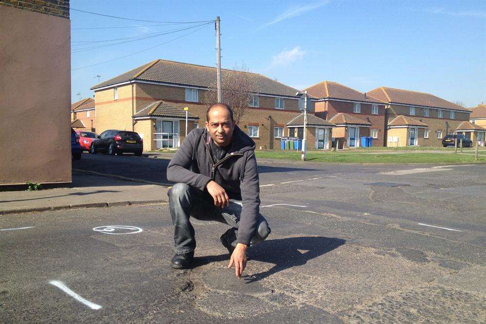 Shahid Ali shows the damaged surface in Granville Road, Sheerness