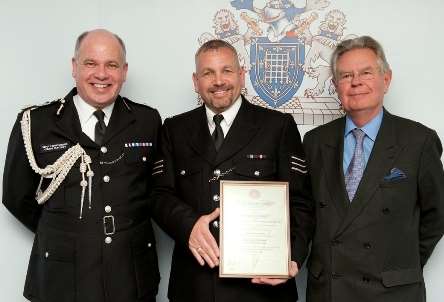 PS Rob Jackson (centre) with deputy commissioner of the Metropolitan Police Craig Mackey (left) and chairman of the Royal Humane Society John Grandy (right)