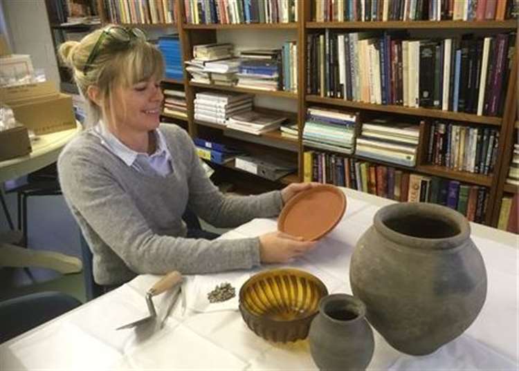 Archaeologist Phillipa Foulds examines Roman pottery found at the site (29010540)