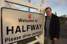Cllr Ken Pugh and the new sign at Halfway