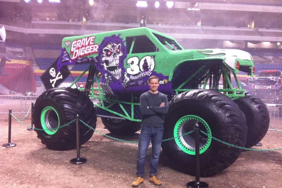David Church from RBLI poses alongside the completed monster truck in San Antonio, Texas
