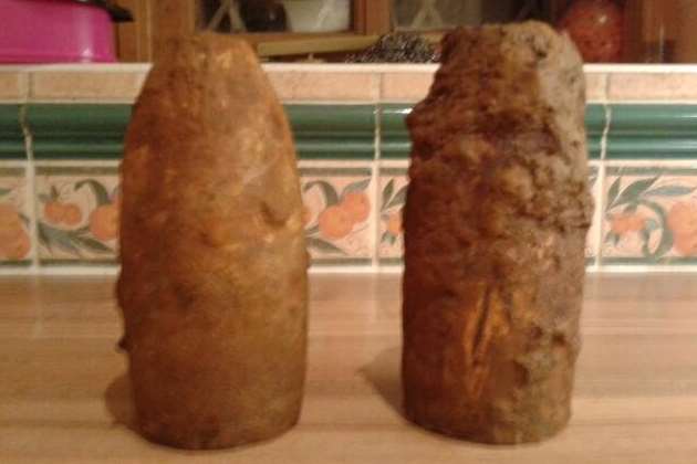 The two muddied wartime rocket heads found in Hawkinge