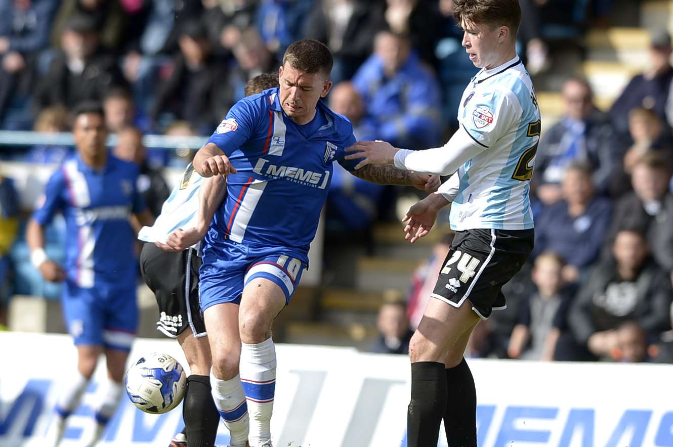 Cody McDonald takes on Shrewsbury's Jack Hendry on Saturday Picture: Barry Goodwin