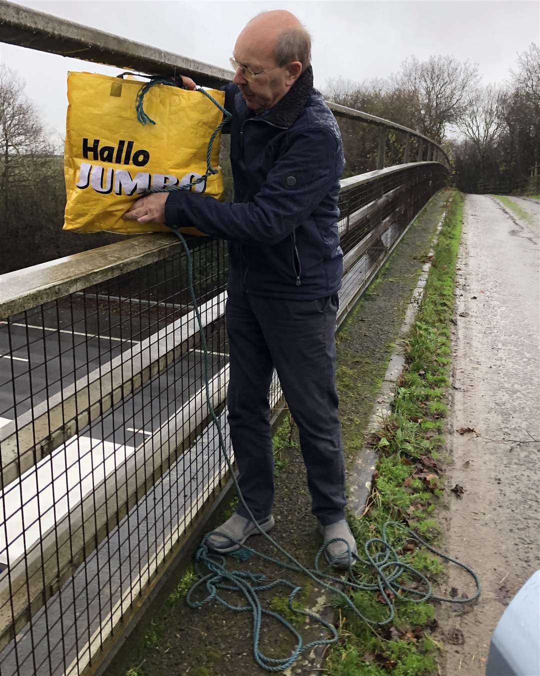 Villagers have been lowering bags down to drivers from the bridges