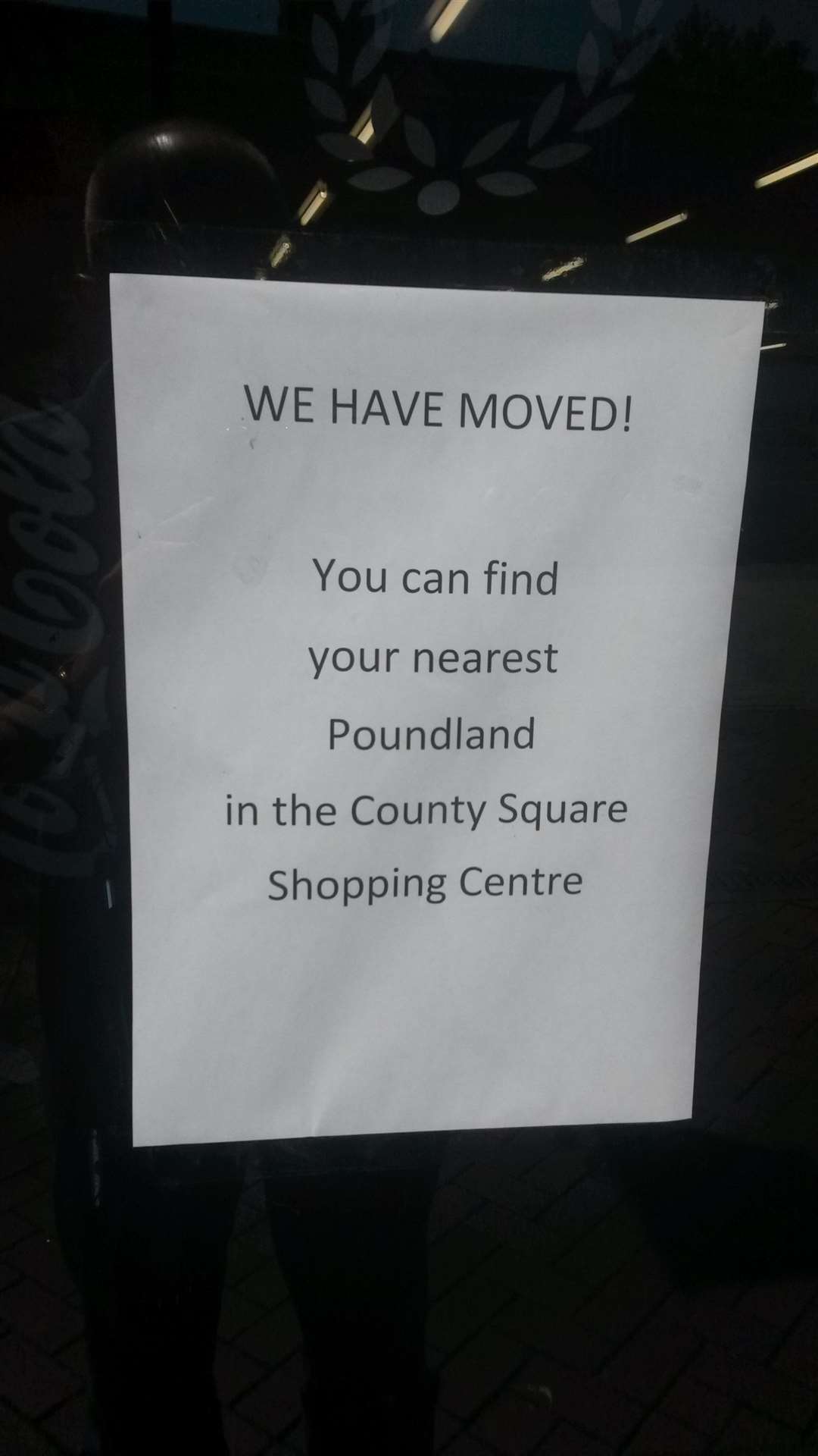 Signs in the Ashford High Street Poundland store's window direct customers to the company's other store in the County Square shopping centre