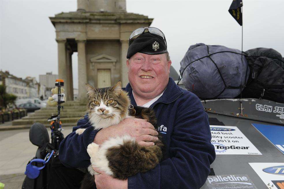 Mark Newton outside Herne Bay Clock Tower with his cat Smudge.