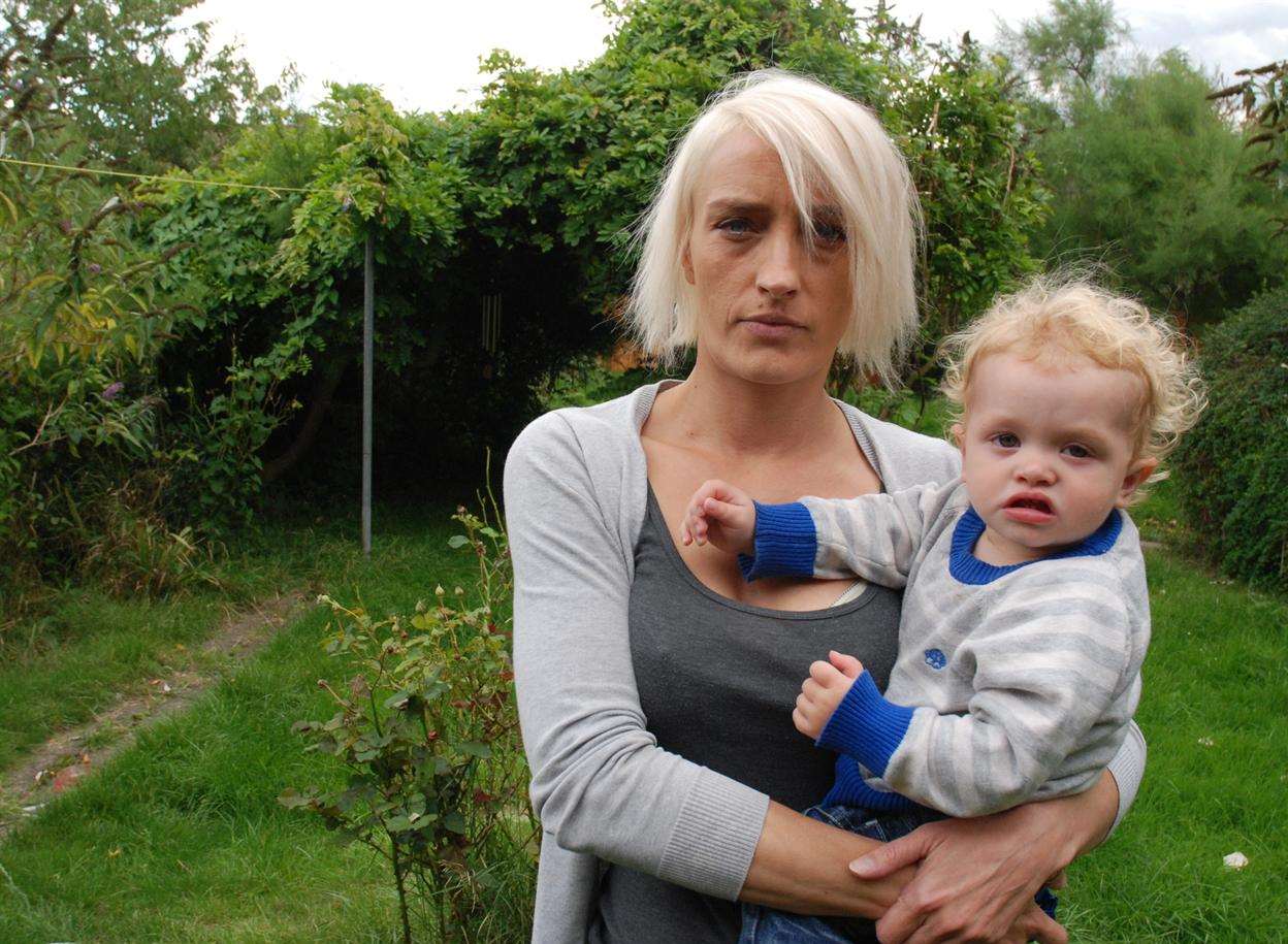Mum Rebecca Jeffs says the dog charged at her while she was holding her baby son Harry in the garden. Picture: Gerry Warren