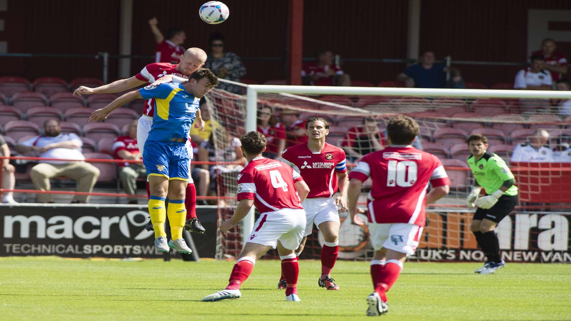 Kenny Clark gets up well to win this header Picture: Andy Payton