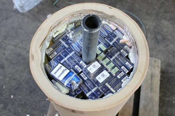 The illicit cigarettes visible inside the tubing. Picture courtesy of HMRC