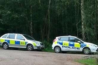 Police and ambulance cars at Clowes Wood, Whitstable after Mr Collett's body was found