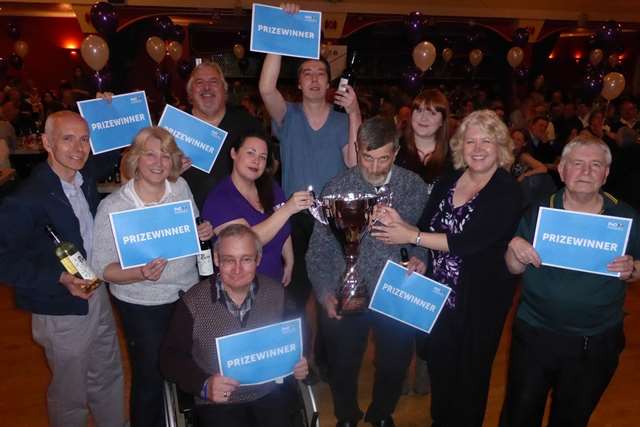 Supernova are crowned champions of the Medway Big Charity Quiz and presented with P&O Ferry vouchers and the trophy by Natalie Winter of main sponsor Qube Recruitment and Sarah Clarke of the Medway Messenger.