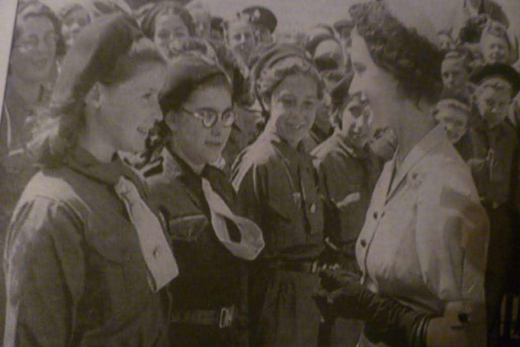 Pam Bellingham in her Girlguiding uniform (aged 12) meeting Princess Margaret on her visit celebrating the 1,000th home built in Newington in 1950.