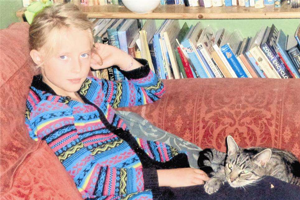 Nine-year-old Erica Courtney with surviving cat Jade