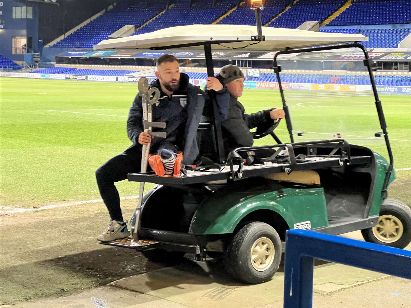 Danny Lloyd leaves Ipswich town FC after the game had finished with a fracture cushion on his left leg Picture: Barry Goodwin