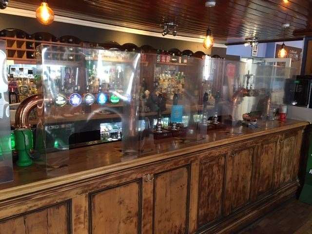 Just part of the hotel’s new safety measures, the plastic screens along the full length of the bar protect both staff and customers