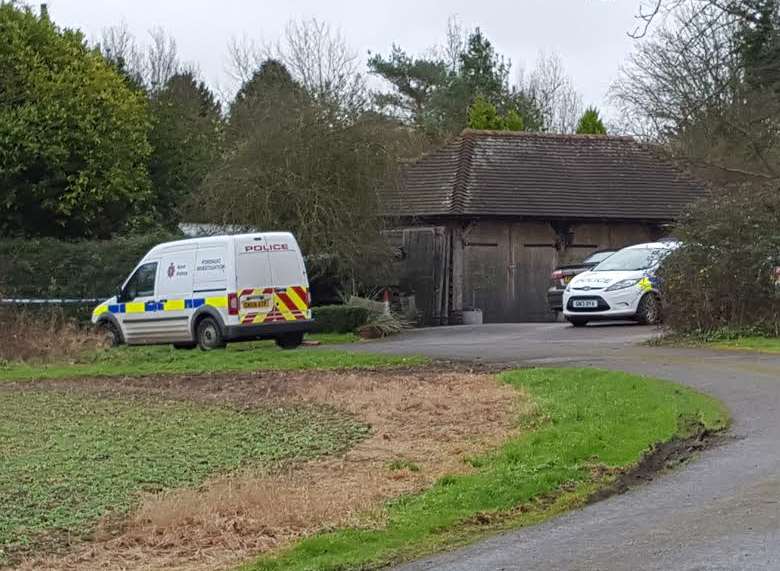 Police at the scene of Mrs Andrews' death in Benenden