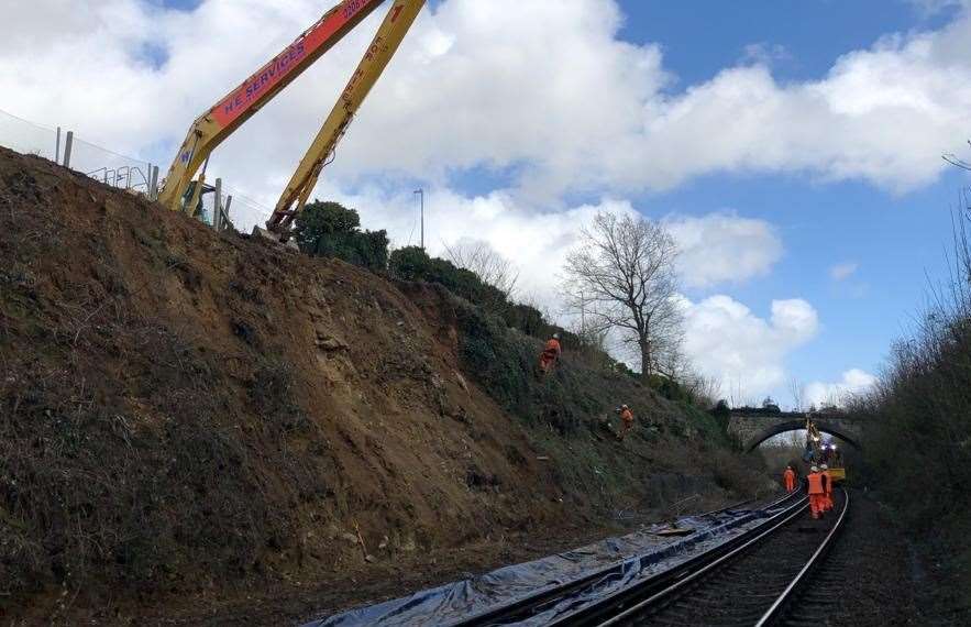Network Rail teams examine the landslip near Bearsted. Picture: Derek Butcher