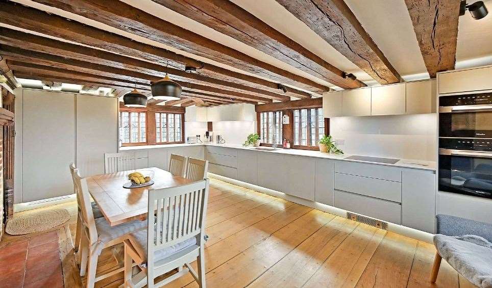 The kitchen is open plan and includes a breakfast bar. Picture: Savills
