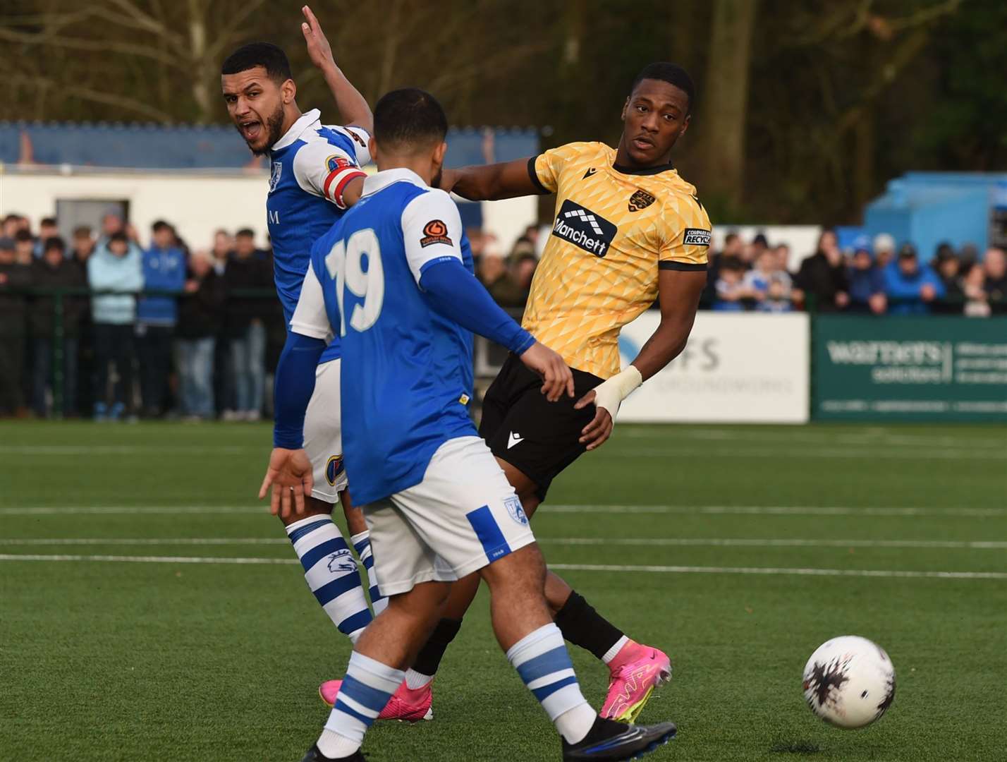 Tonbridge captain Kodi Lyons-Foster and Jernade Meade with Timmy Abraham of Maidstone. Picture: Steve Terrell