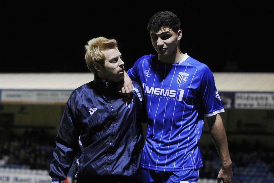 Ryan Inniss leaves the field after being injured in his Gills debut against Sheffield United. Picture: Barry Goodwin