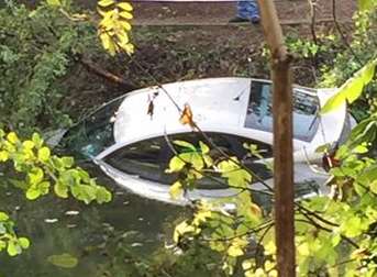 The white car plunged into the canal. Picture uploaded to Facebook by Jane Whitlock