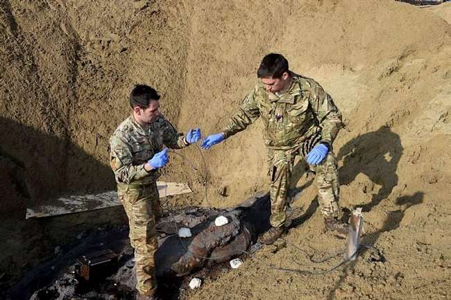 Sgt Ed Clinton and Sgt Rich McKinnon, of 11 EOD Regt RLC placed the charges on the bomb and then walked back to a safe area 500 metres to fire the charge. Picture: Richard Watt/Ministry of Defence.