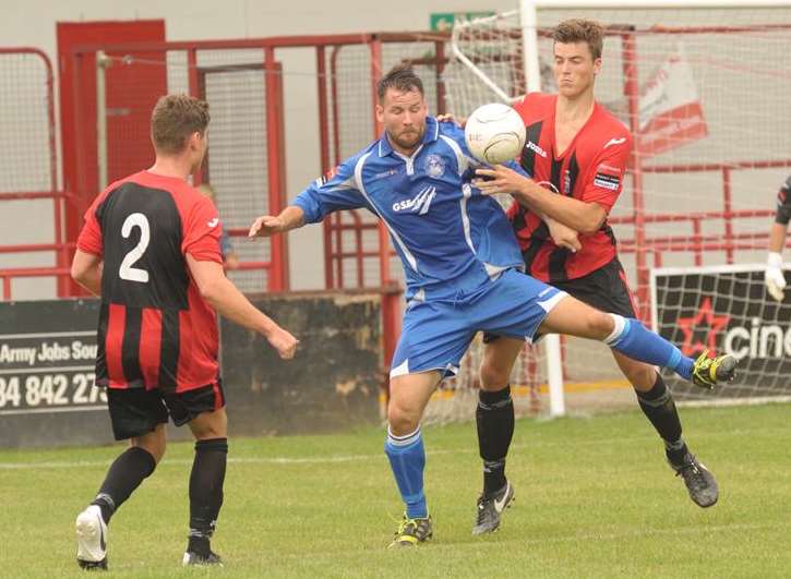 Craig Thompson (blue) in action for Hythe in their final pre-season friendly at Chatham Picture: Steve Crispe