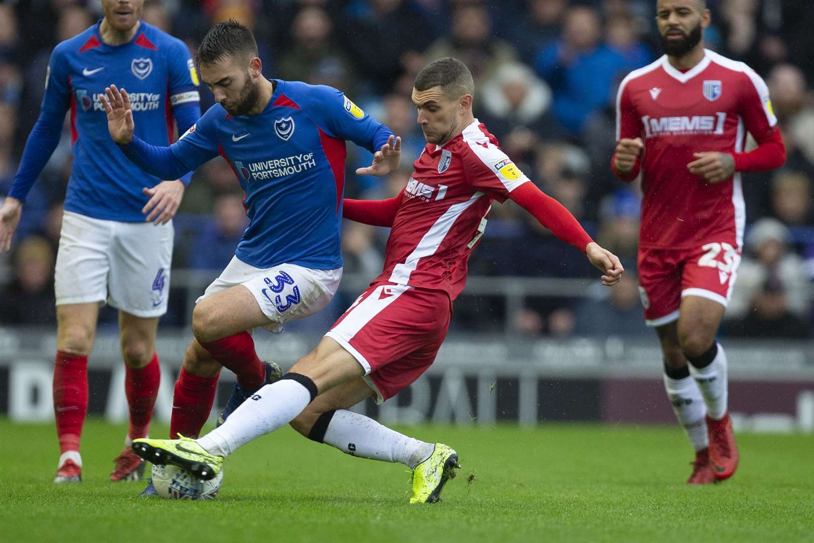 Stuart O'Keefe gets in a challenge for the Gills at Portsmouth Picture: Kent Pro Images