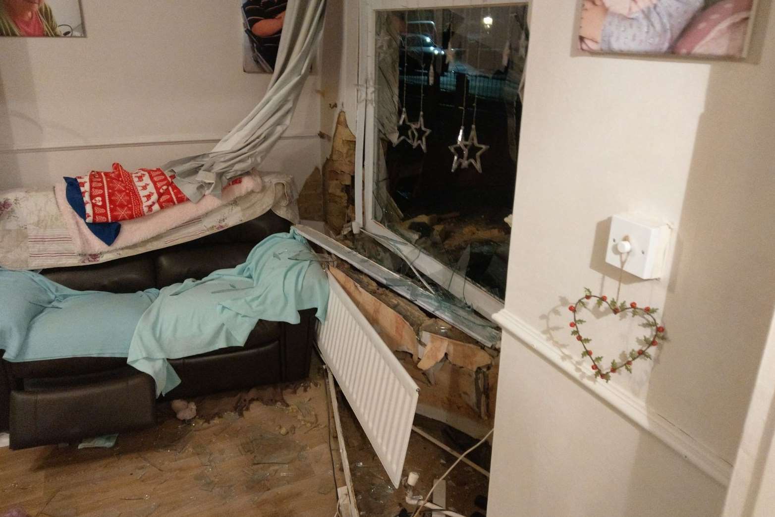 The car ploughed into the living room of the home in Elm Grove, Murston