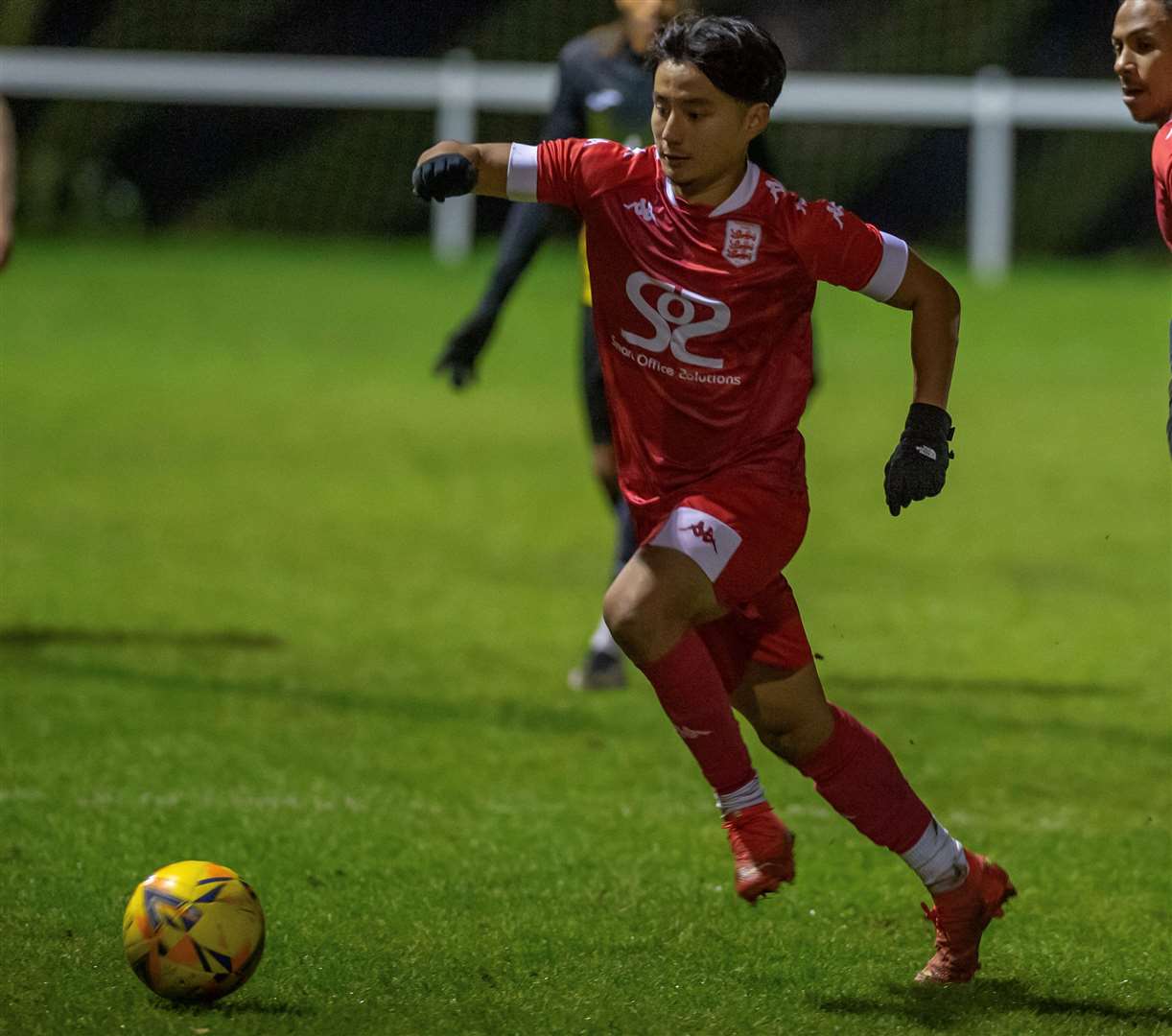 Young Faversham player Eban Gurung strides through midfield. Picture: Ian Scammell