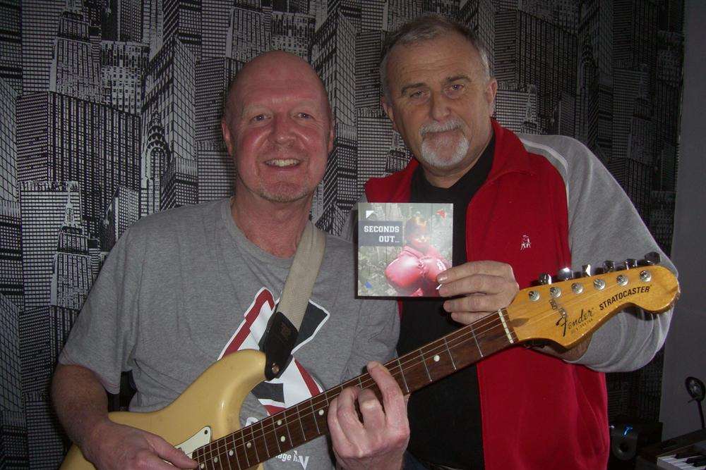 Martyn Wood from Sittingbourne (right) with John Hedley-Cheney and a copy of Seconds Out.
