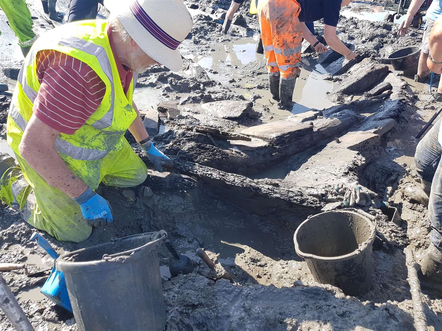 A volunteer carrying out excavation work at the ship's bow