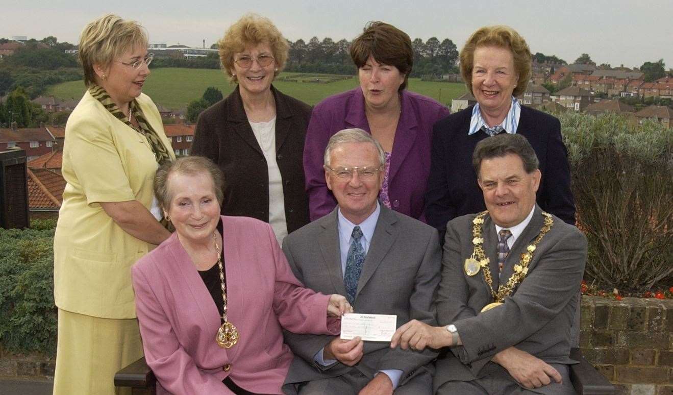 Pictured in October 2002, the chairman of the Friends of Wisdom Hospice, Peter Hopgood, receiving a cheque from mayor and mayoress Ted and Sylvia Baker, watched by fellow fundraisers
