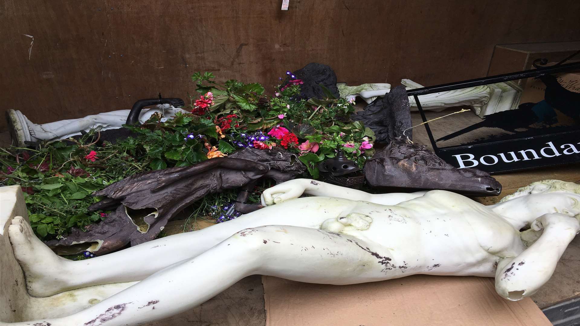 A smashed statue and debris recovered from the Tenterden Garden Centre raid