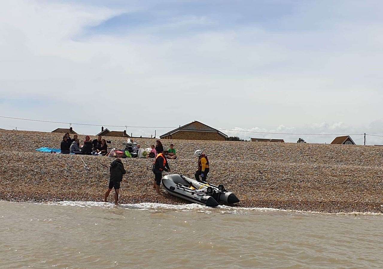 Crew member Heather Crittenden returning the casualties to their family and the safety of the shore. Photo: Peter Leigh