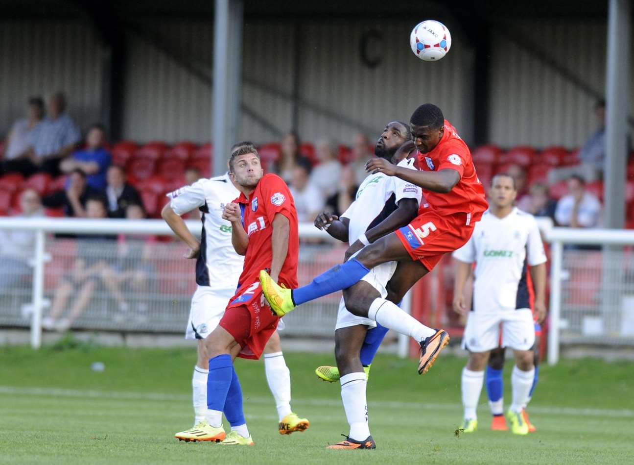 Gills new signing Kortney Hause in an aerial battle against Dover Picture: Tony Flashman
