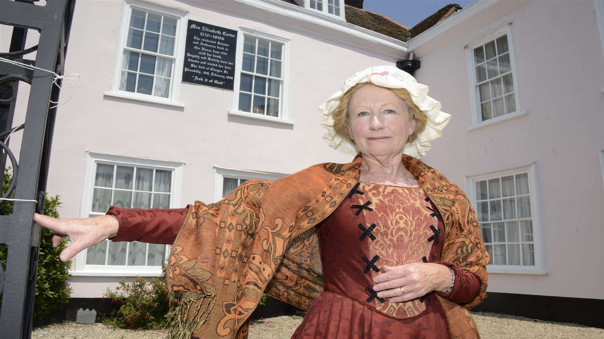 Lynn Archer in Period Costume outside Carter House Deal
