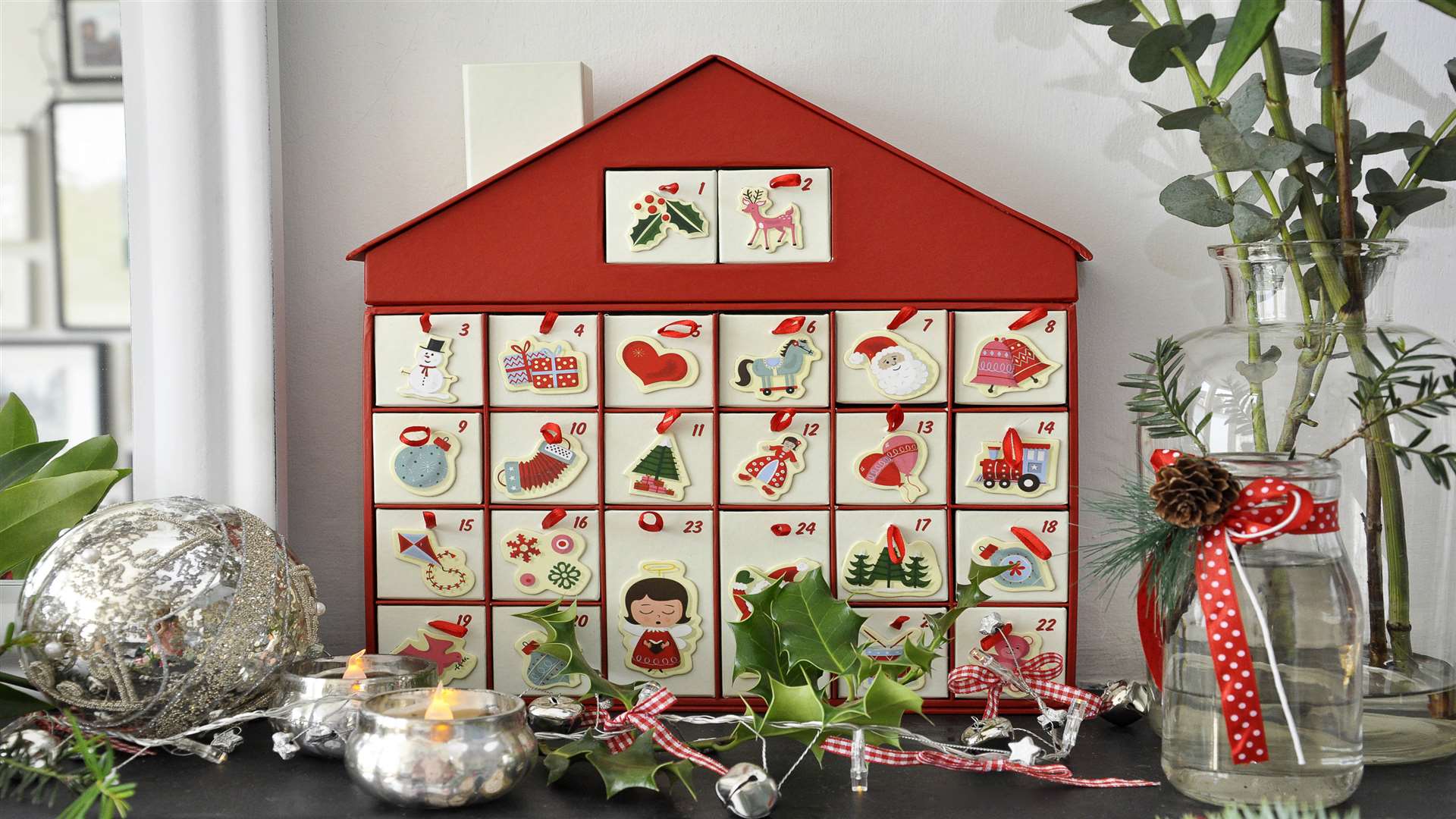 We love this 1950s Christmas house advent calendar, £18.95, www.dotcom giftshop.com