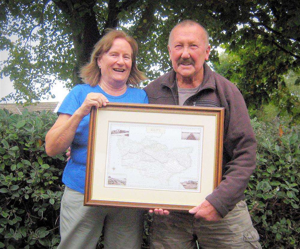 Gordon Sencicle is presented with his framed print of Kent by White Cliffs Ramblers chairman Margaret Lubbock