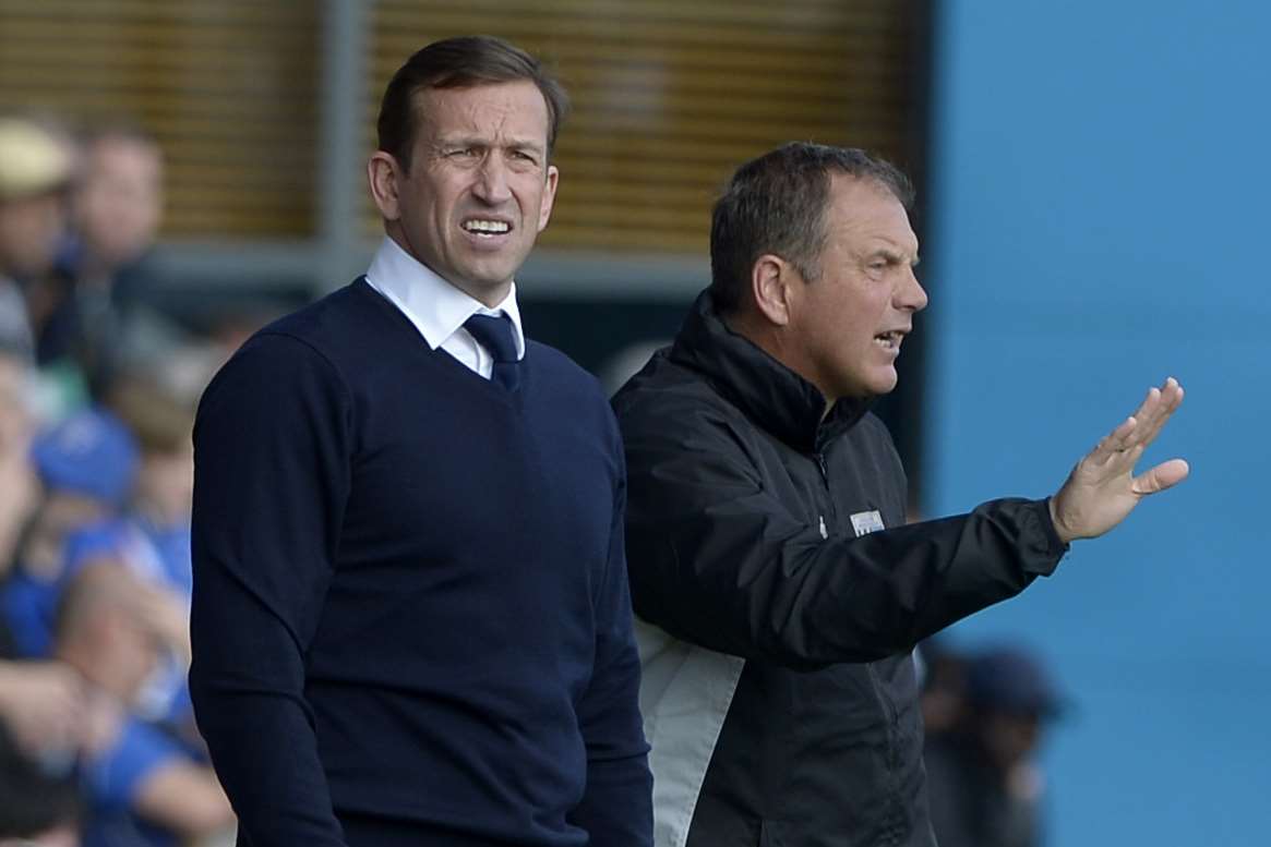 Gills boss Justin Edinburgh and departed coach Steve Lovell Picture: Barry Goodwin