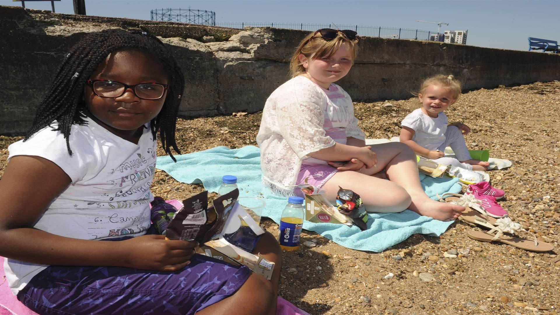 Megan, eight, Lucy, nine, Sharleigh, two, enjoying the hot weather at the Strand, Gillingham