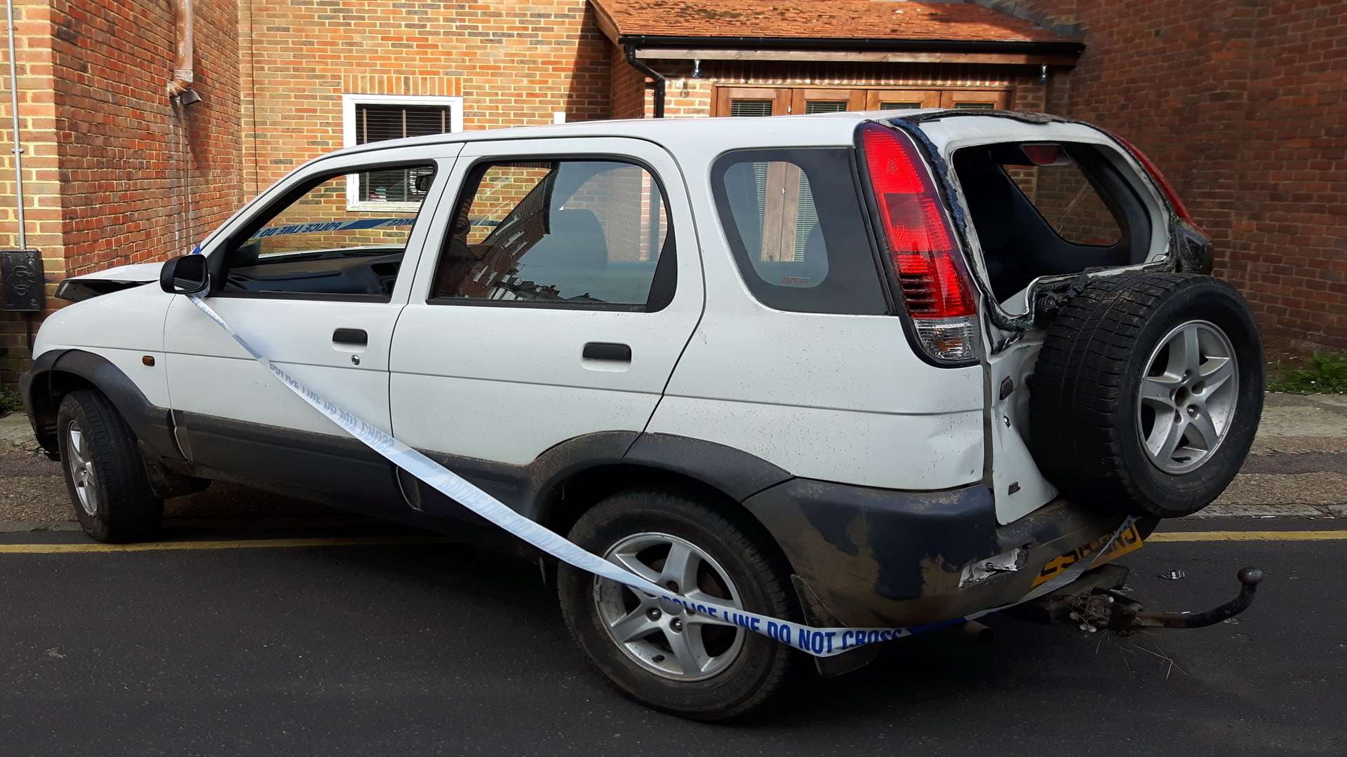 A battered white Daihatsu Terios was abandoned on Dover Street in Canterbury.